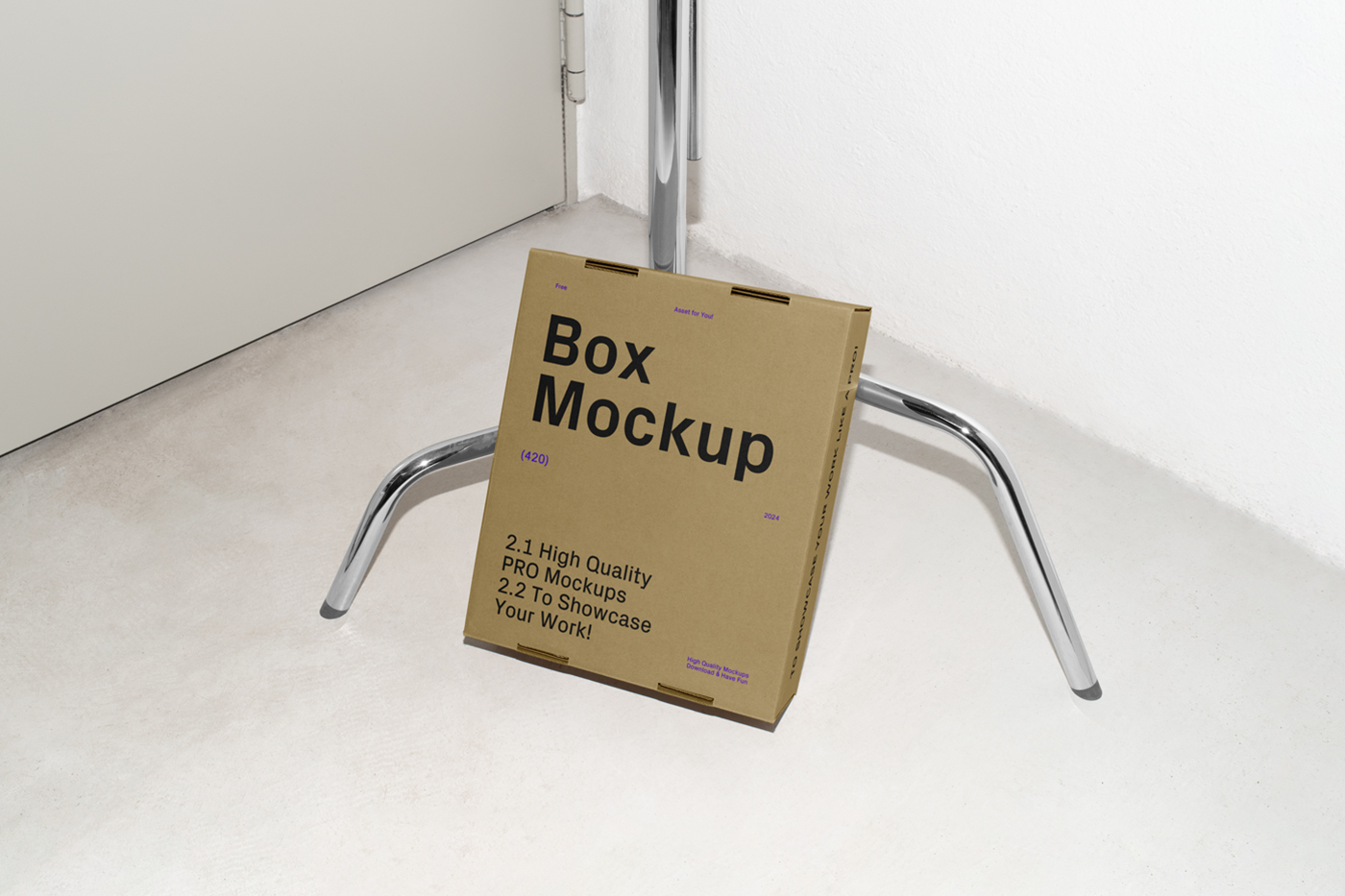 View from above, of a craft cardboard box mockup with black strong typography design based on a metal tripod.