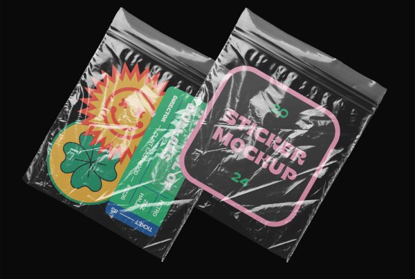Four custom shape colorful sticker mockup in two transparent foils laying on the black background.