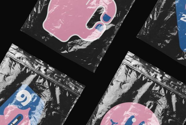 Four custom shape colorful sticker mockup in transparent foil laying on the black background.