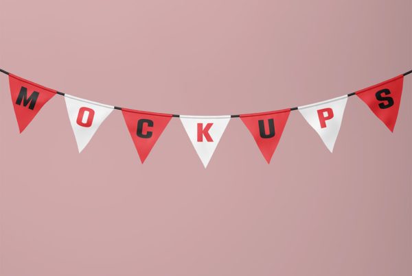 Hanging garland flag mockup in the shape of triangles in front of the red wall.