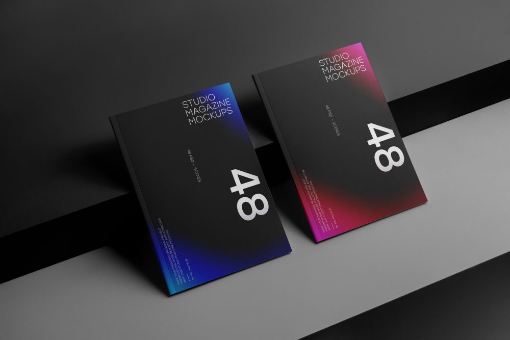 Two a4 magazine with black mdesign on cubes from studio magazine mockups.