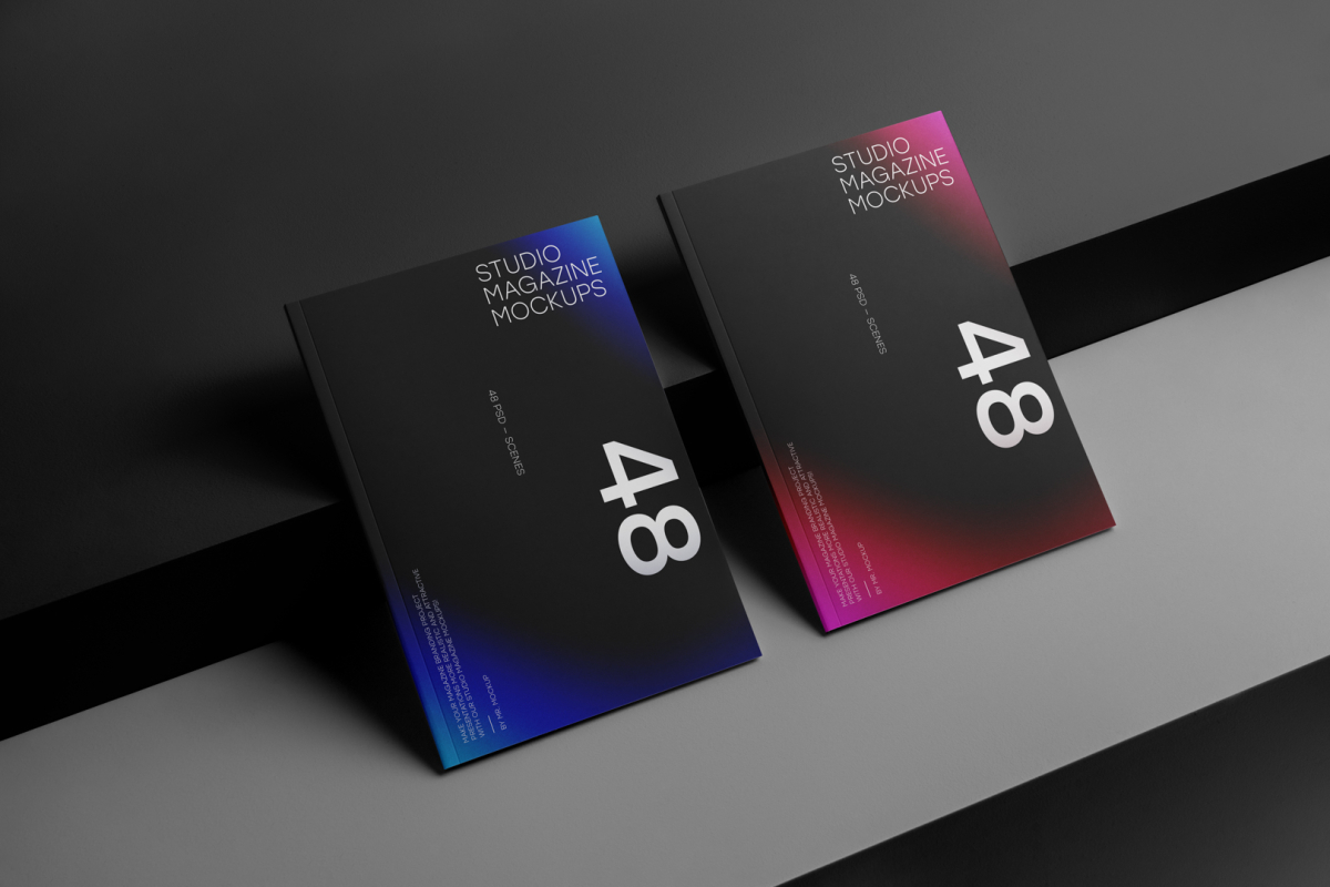Two a4 magazine with black mdesign on cubes from studio magazine mockups.