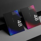 Two a4 magazine with black mdesign on cubes from studio magazine mockups.