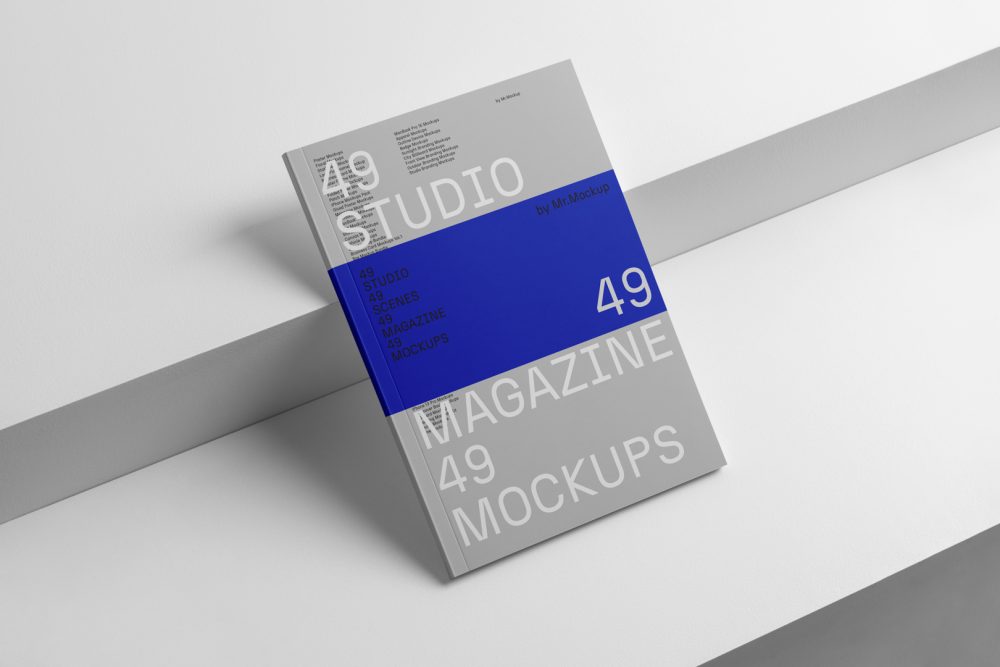 Gray a4 magazine on white cubes from studio magazine mockup.