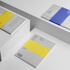 Three gray a4 magazine with minimal design on white cubes from studio magazine mockups.