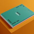 Three a4 magazine mockup with playful design on orange cube from studio magazine mockups.