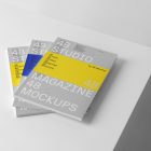 Three gary magazine with minimal design on cube from studio magazine mockups.