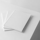 Three a4 white magazines on white cubes from studio magazine mockups.