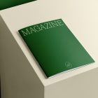 Green thin magazine with elegant design on cube from studio magazine mockups.