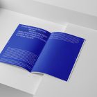 Open a4 magazine with blue minimal design from studio magazine mockups.