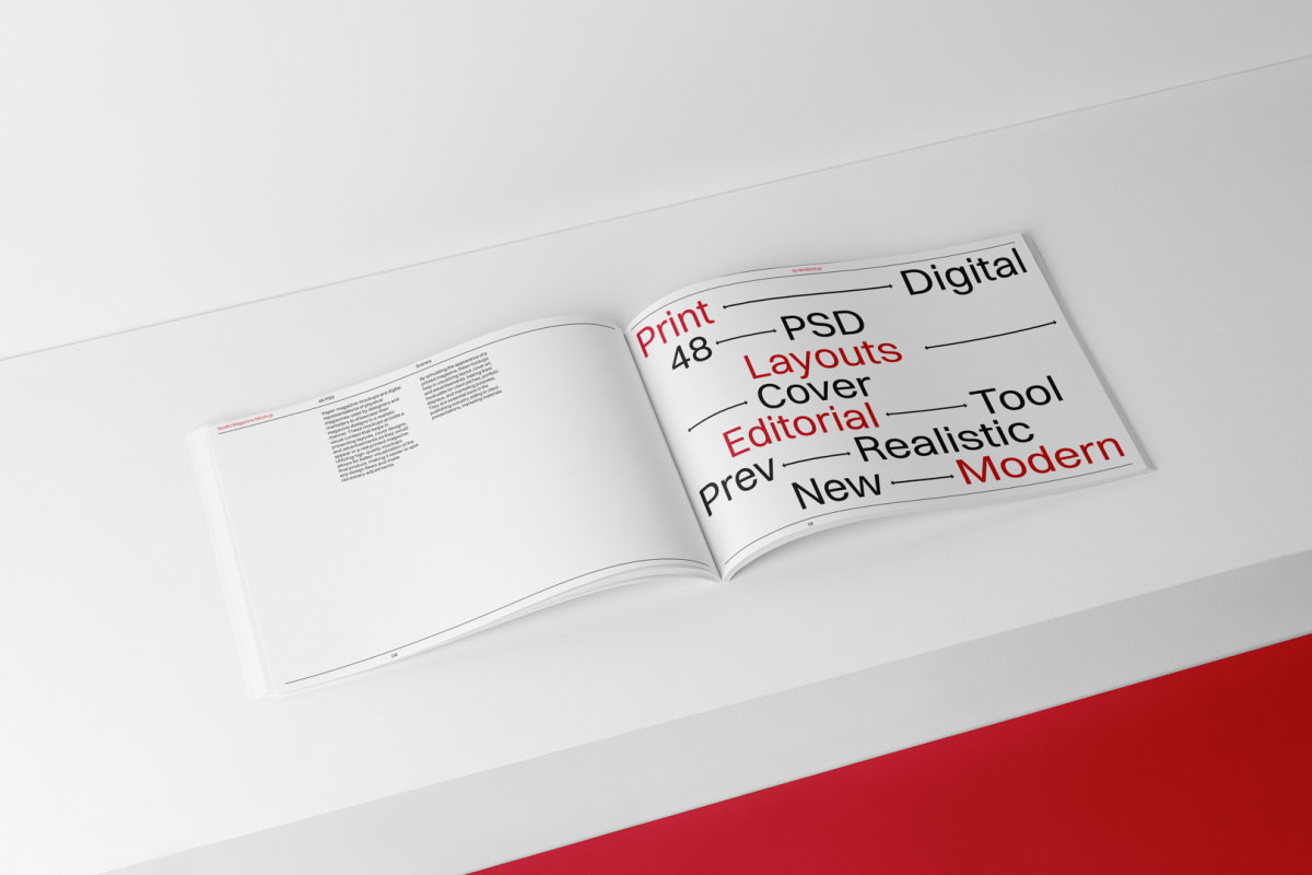 Open horizontal magazine with black and red design from studio magazine mockups.