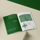 Open a4 magazine with green elegant design on cubes from studio magazine mockups.