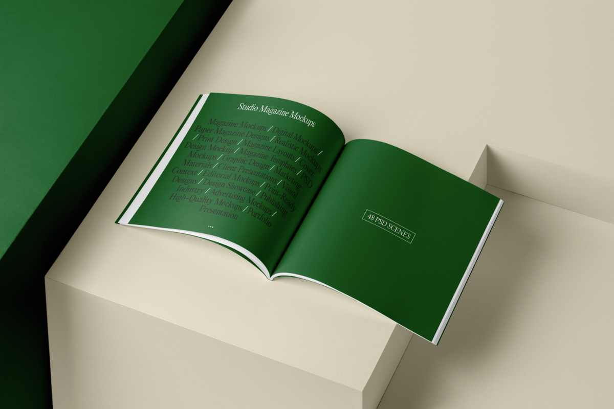 Open square magazine with green elegant design on cubes from studio magazine mockups.