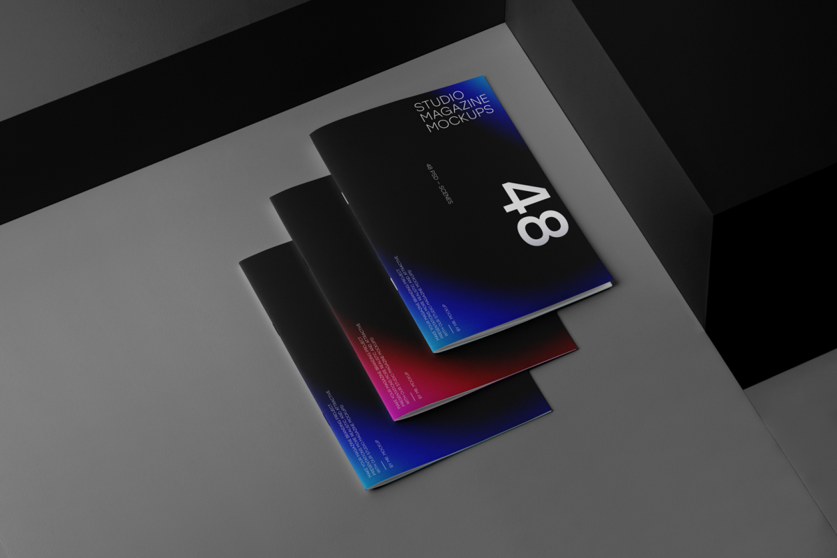 Three a4 magazine with dark modern design on black cubes from studio magazine mockups.