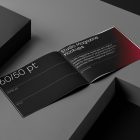 Open horizontal magazine with black modern design on dark cubes from studio magazine mockups.