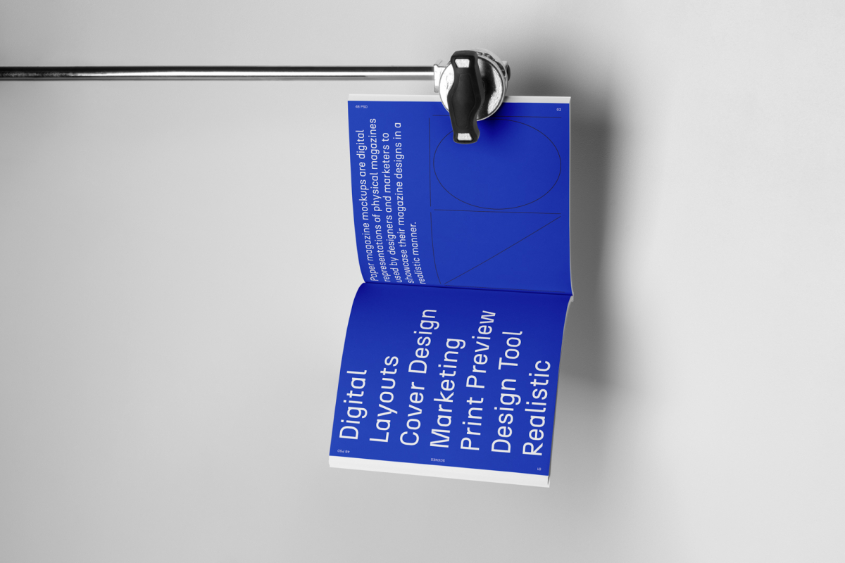 Open square magazine with blue minimal design from studio magazine mockups.