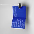 Open square magazine with blue minimal design from studio magazine mockups.