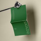 Green magazine cover with elegant design on cube from studio magazine mockups.