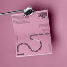 Pink a4 magazine mockup with playful design on cube from studio magazine mockups.