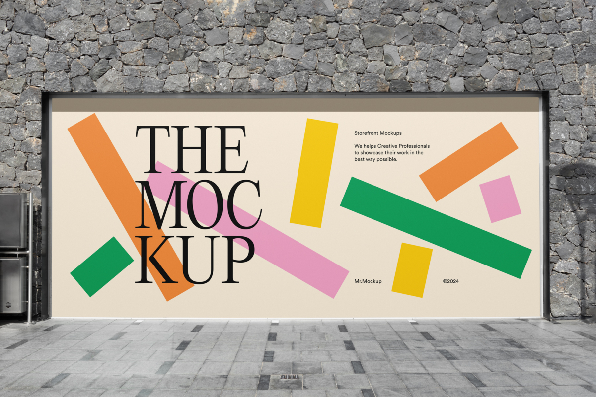 Front view, rectangle with colorful graphics and black typography space built into a stone gray wall from storefront mockups product.