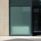 Front view, window with gray frames built into the building from storefront mockups product.