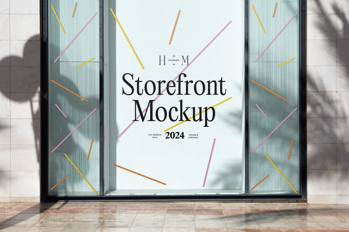 Front view, transparent display window case with colorful graphics and white typography in the building divided into three parts with black frames from storefront mockups product.