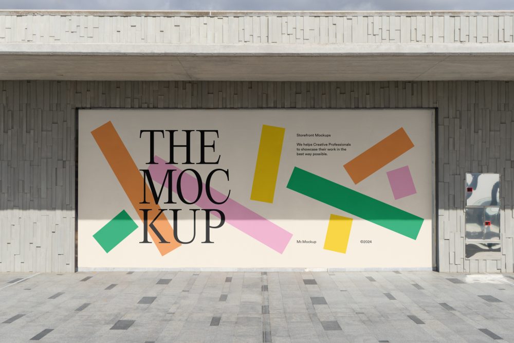 Front view, rectangle with colorful graphics and black typography space built into a stone beige wall from storefront mockups product.
