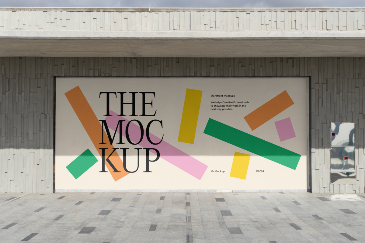 Front view, rectangle with colorful graphics and black typography space built into a stone beige wall from storefront mockups product.