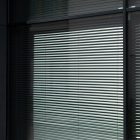 Front view, at an angle of 45 degrees, clean glass window with visible blinds behind the glass from storefront mockups product.