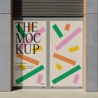 Front view, two rectangles with colorful graphics, black typography spaces built into a building elevation from storefront mockups product.
