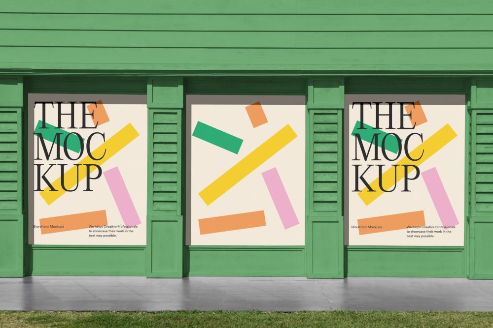 Front view, three colorful rectangle spaces with black typography built into a green building elevation from storefront mockups product.