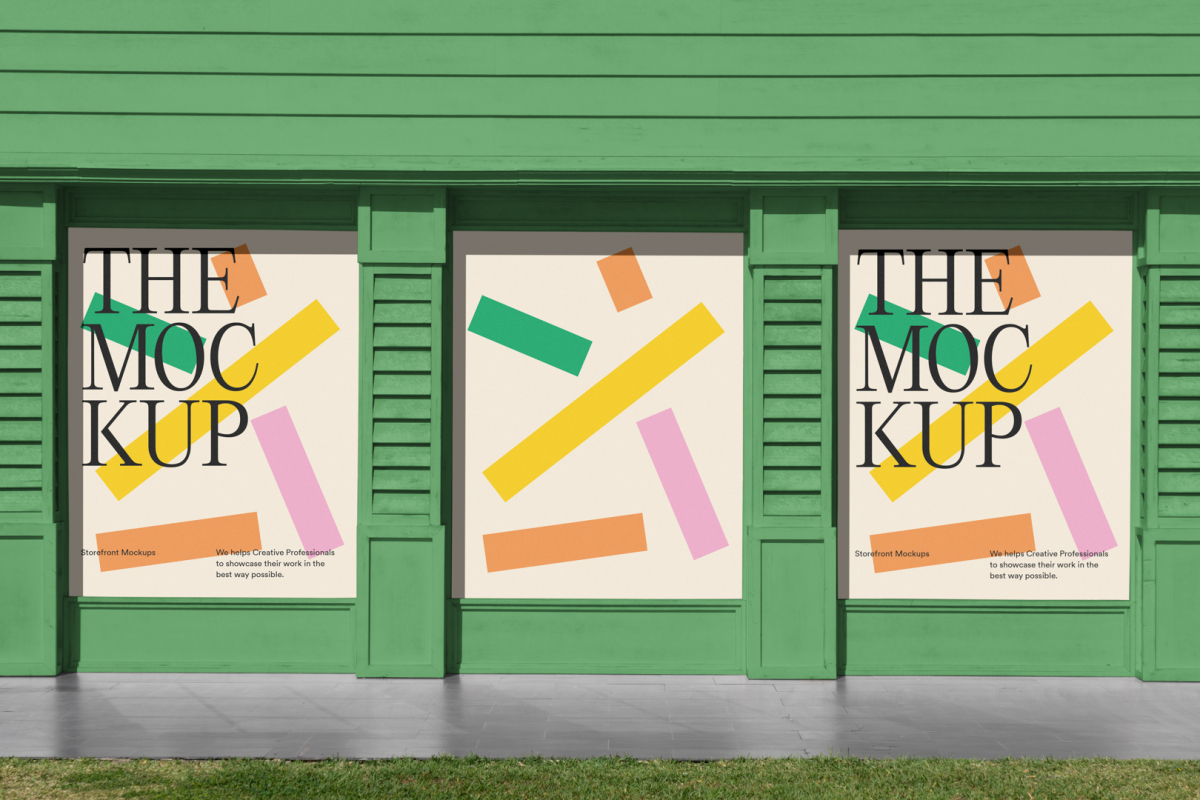 Front view, three colorful rectangle spaces with black typography built into a green building elevation from storefront mockups product.