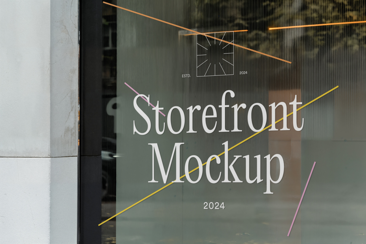 Front view, at an angle of 45 degrees, clean glass window with colorful graphics and white typography from storefront mockups product.