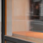 Front view, at an angle of 45 degrees, part of window from storefront mockups product.