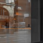 Front view, at an angle of 45 degrees, part of window from storefront mockups product.