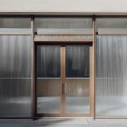 Front view, entrance to the staircase facade with brown frames, eight windows and close glass door from storefront mockups product.