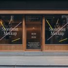Front view, wooden restaurant facade with transparent windows and door with colorful graphics and white typography from storefront mockups product.