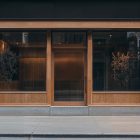 Front view, wooden restaurant facade with transparent windows and door from storefront mockups product.