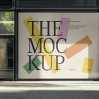Front view, transparent window with black frames and one big rectangle with colorful graphics and black strong typography space from storefront mockups product.