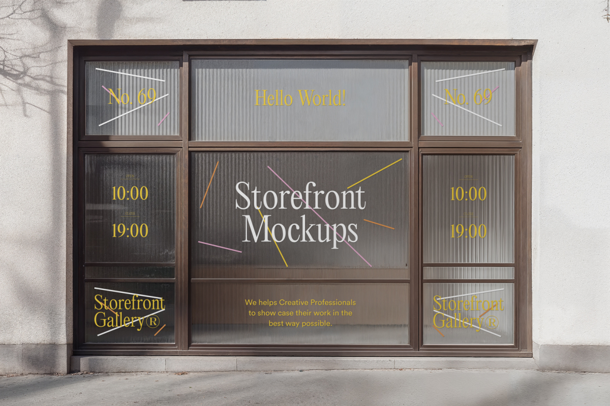 Front view, entrance to the small shop facade with brown frames, windows with colorful graphics and white strong typography, close glass door from storefront mockups product.