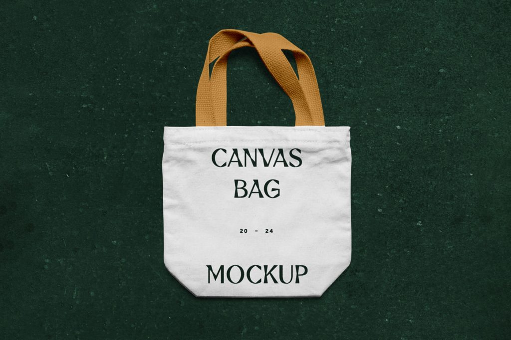 View from above, canvas bag mockup laying on the green marble color floor.