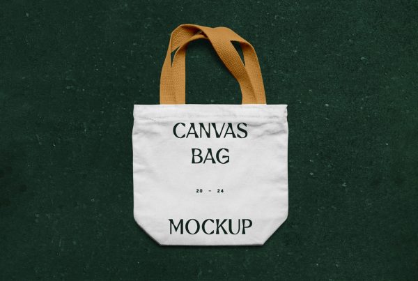 View from above, canvas bag mockup laying on the green marble color floor.