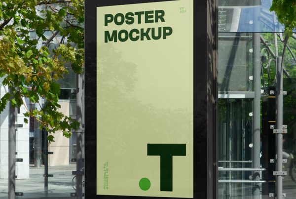 City light billboard mockup standing pedestal between the buildings in the middle of the city in the background.