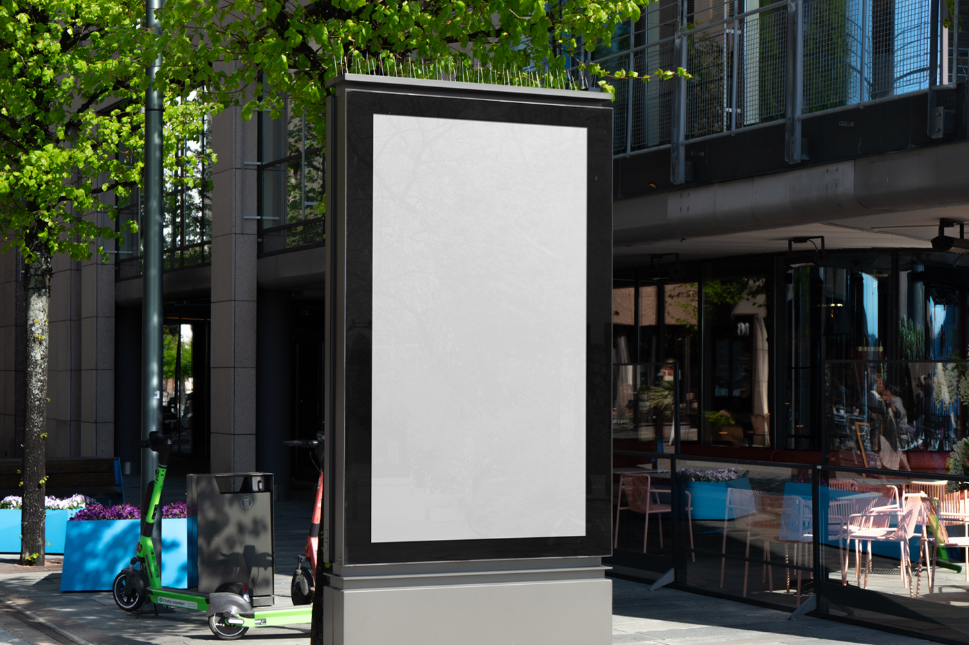 City light white billboard mockup standing pedestal between the buildings in the middle of the city in the background.