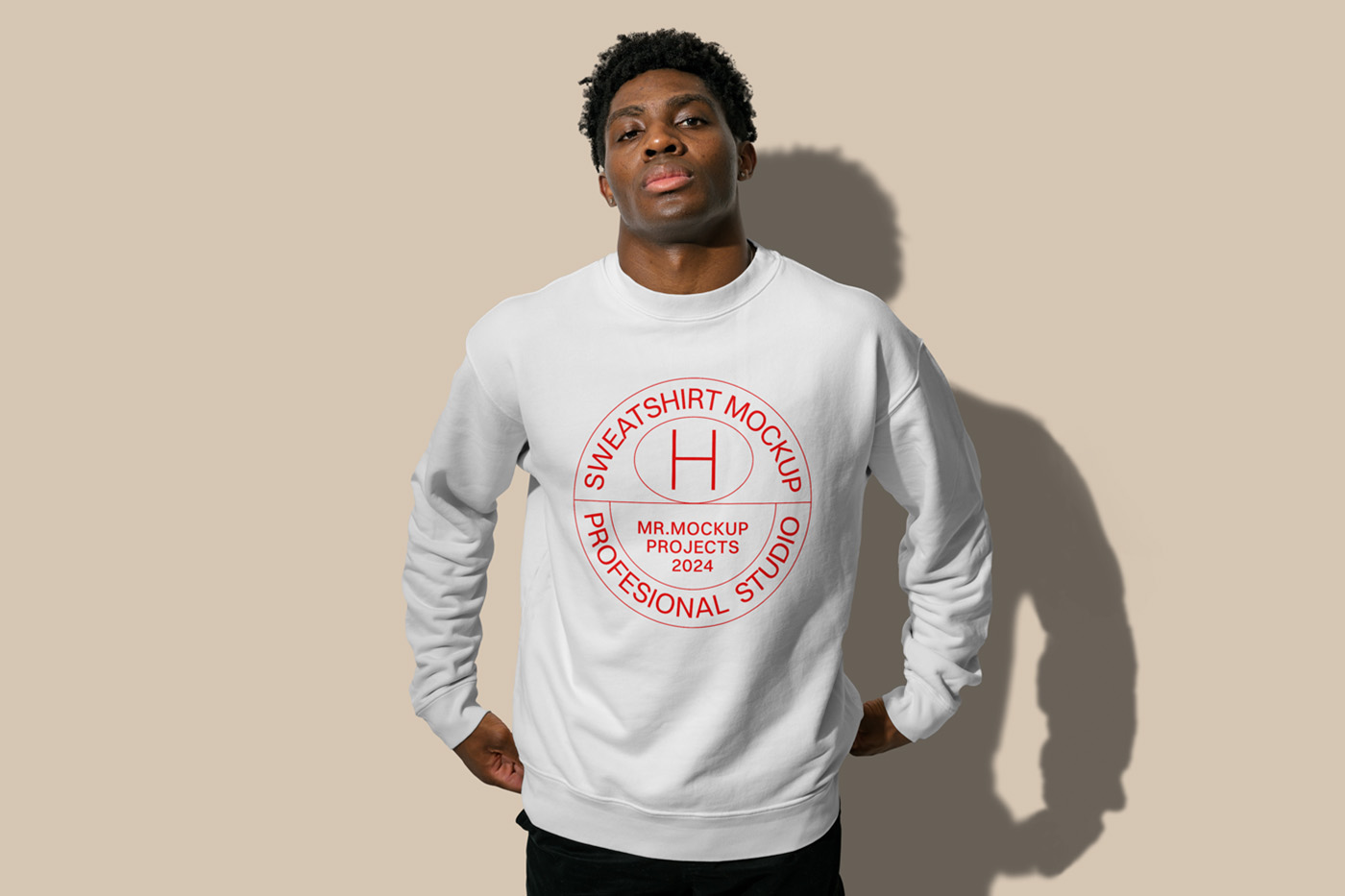 Standing men wearing sweatshirts with a red logo in front of the beige wall.