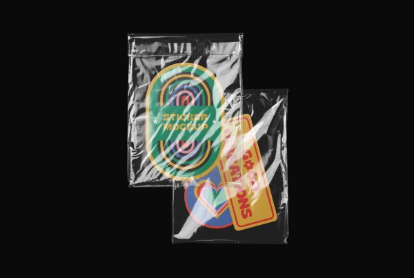 Three custom shape colorful sticker mockup in transparent foil on the black background.