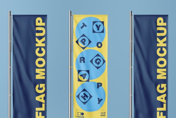 Front view, three navy vertical flag mockups standing in front of the blue wall.