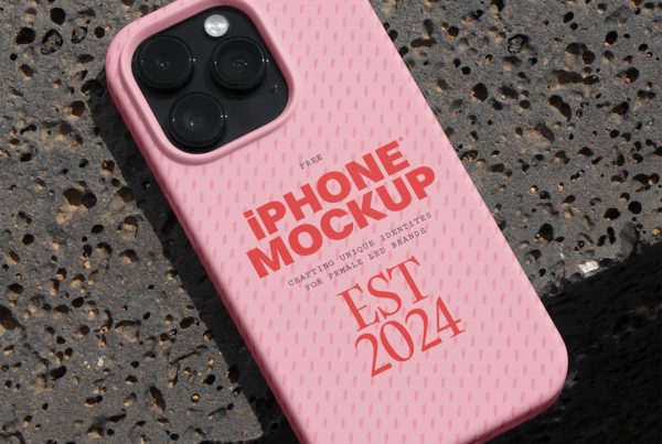 View from above, pink iPhone case mockup laying on the concrete floor.