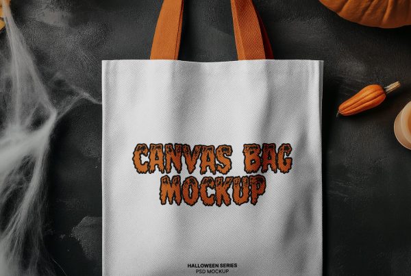 View from above, Halloween canvas bag mockup laying on the black floor.