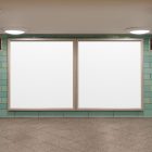 Front view, two white square city billboard mockups with silver frames attached to the green wall tiles.